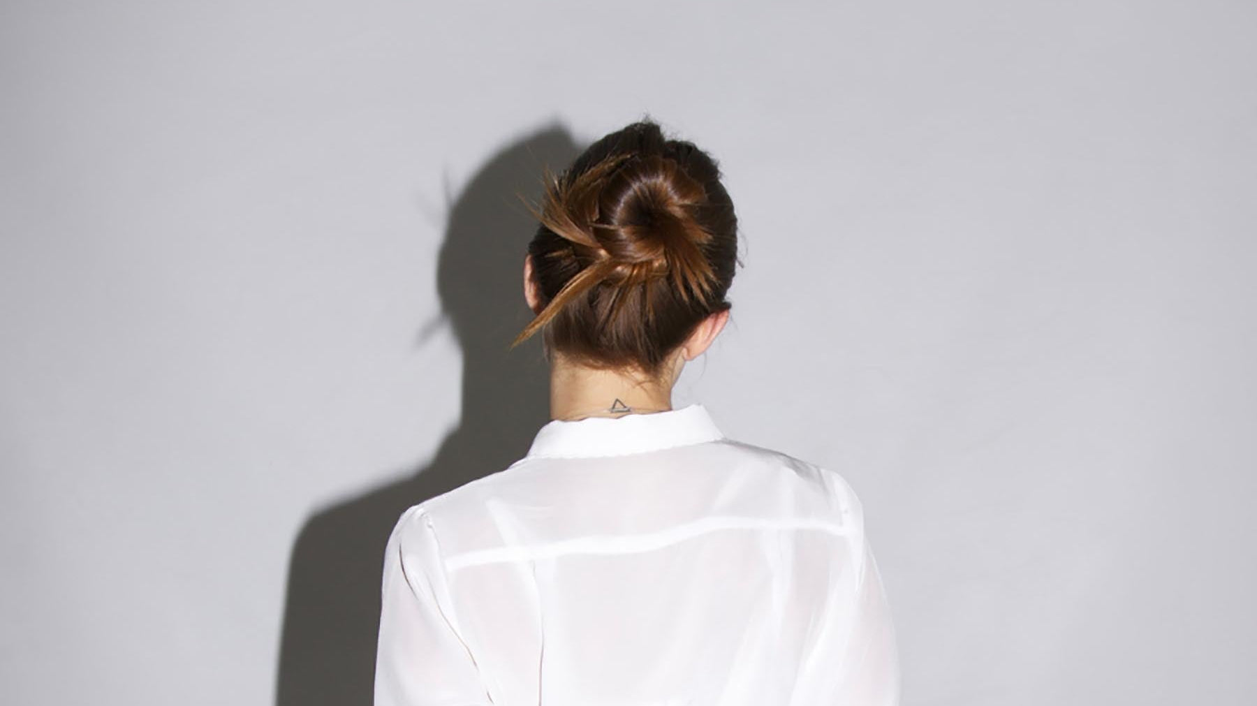 girl with bun for winter using neuma products