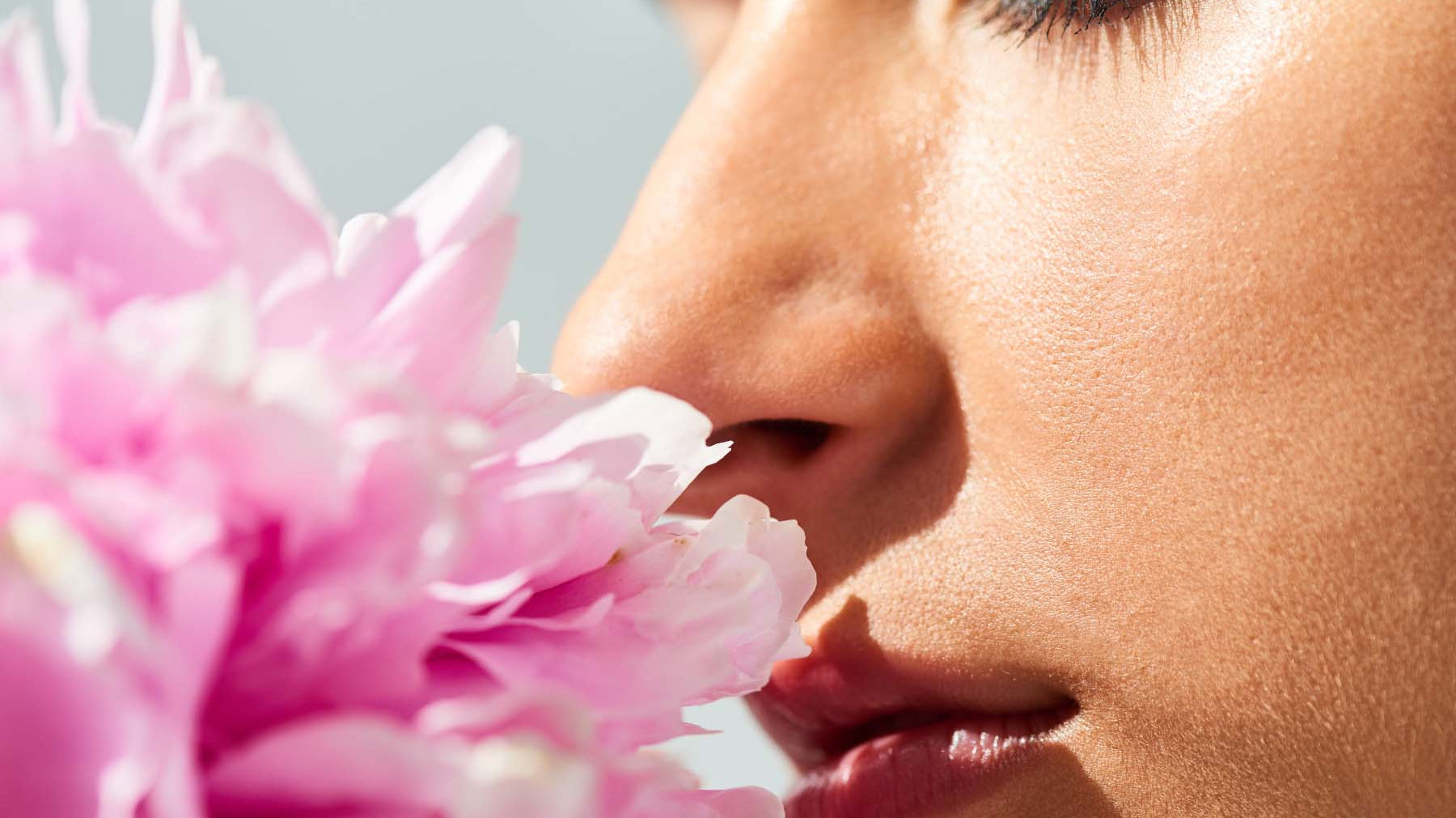 woman breathing in floral scent