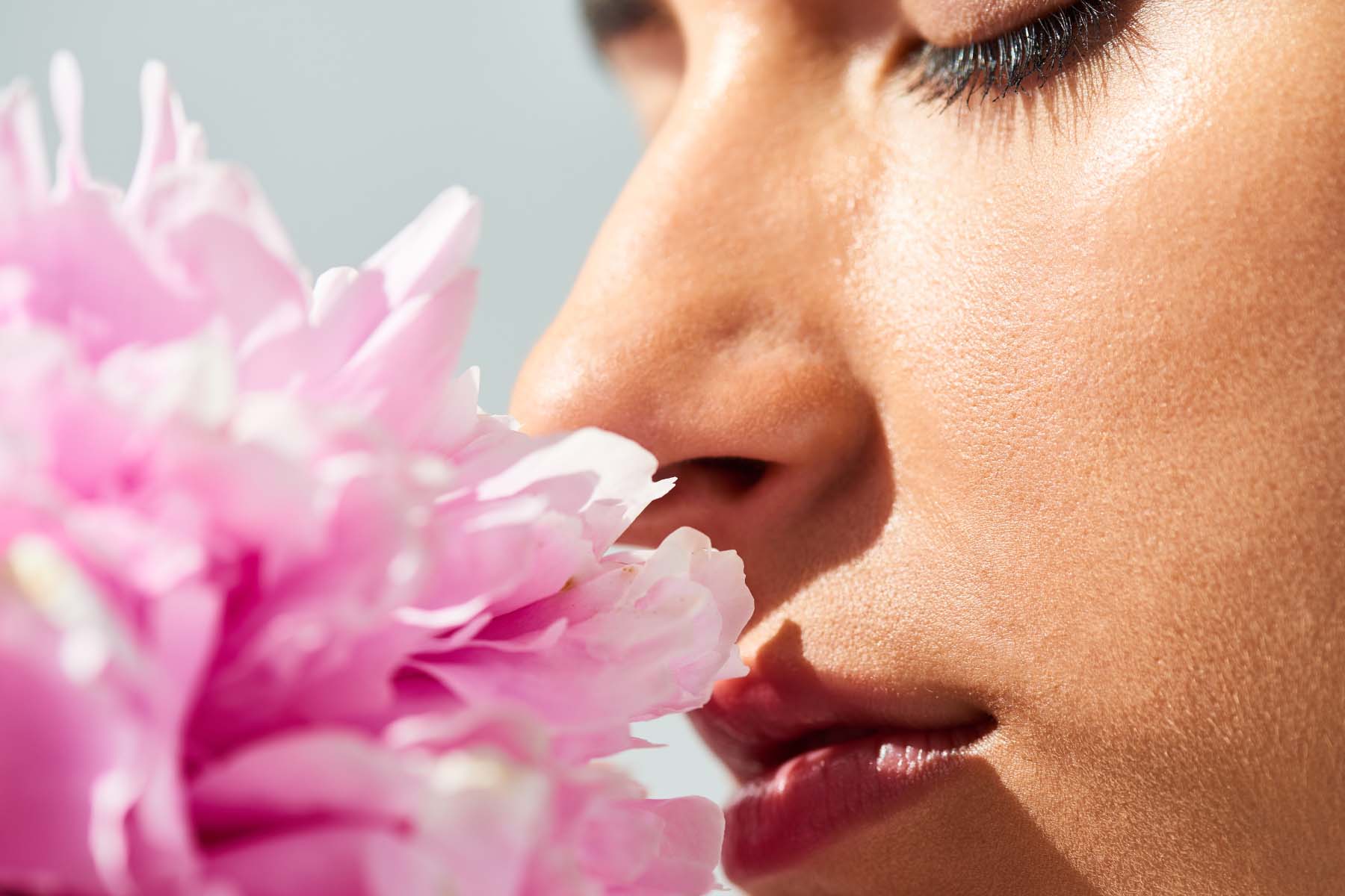 woman breathing in floral scent